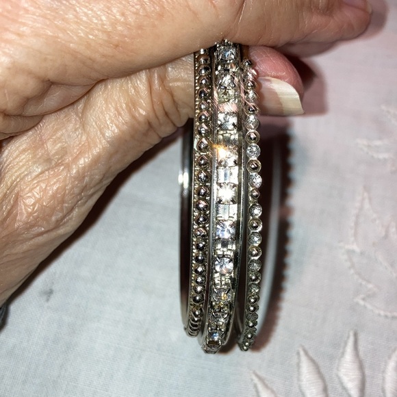 Set of 6 Silvertone bangle bracelets w/ appx 3” diameter, various textures $10 - Picture 6 of 7